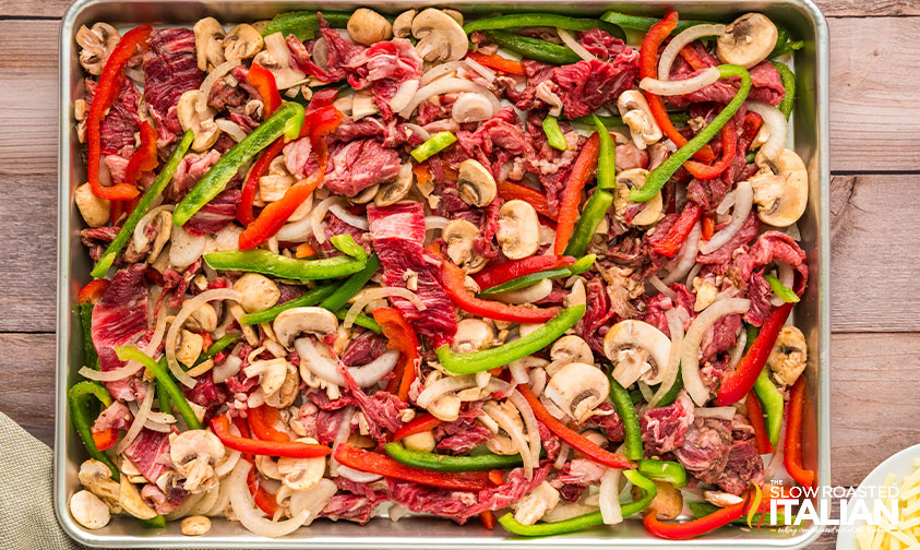 sheet pan philly cheesesteaks ready for the oven