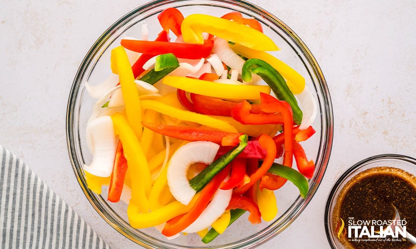 peppers and onions in a large mixing bowl