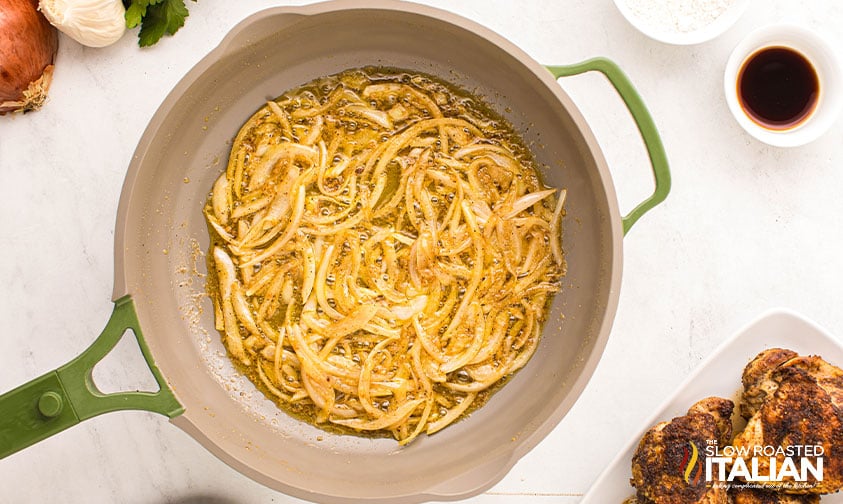 slice onions and minced garlic sauteed in a skillet