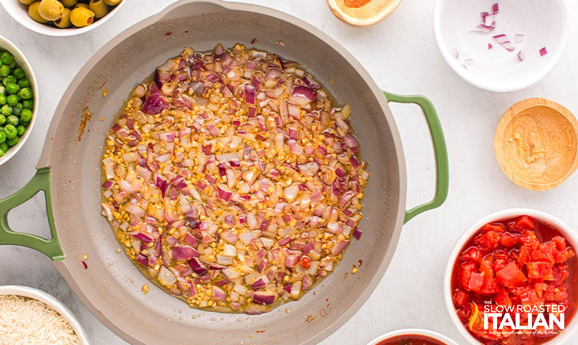 sauteed red onion and garlic in a large skillet