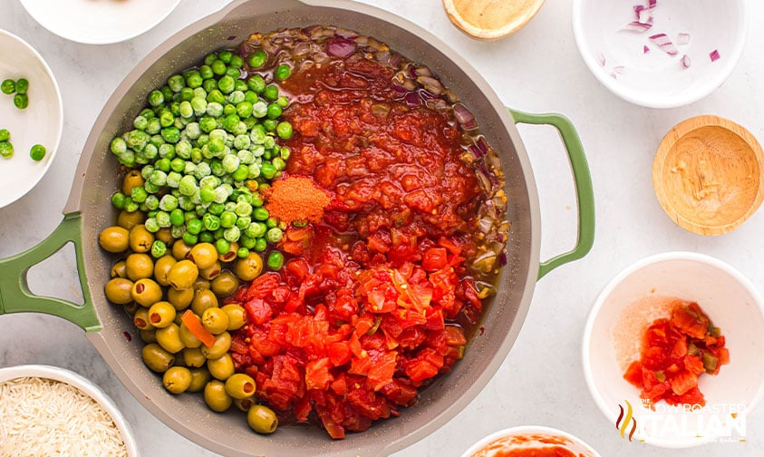 rotel, salsa, olives and peas added to skillet