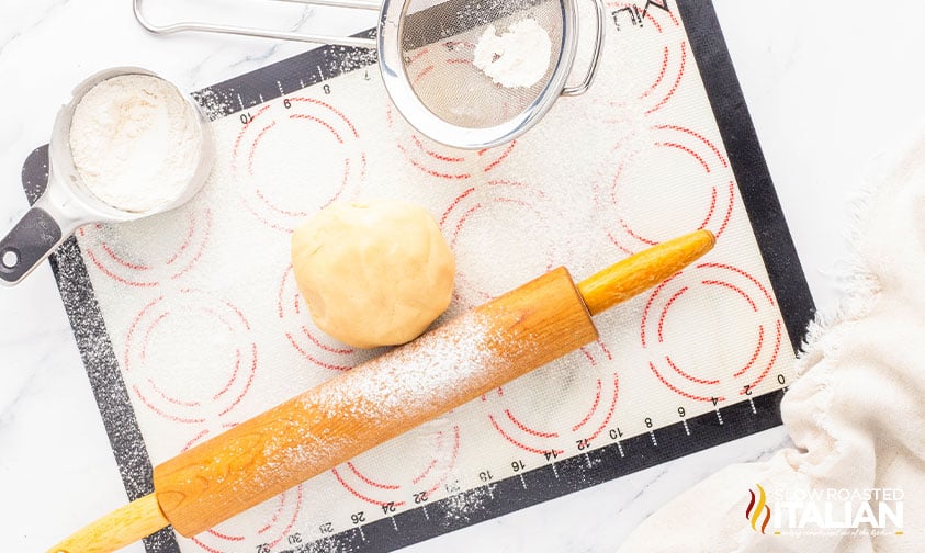 rolling out cookie dough for valentine's sugar cookies