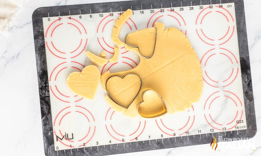 cutting out valentine's sugar cookies