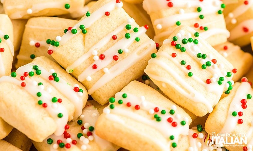 closeup: frosted mini sugar cookies with nonpareil sprinkles