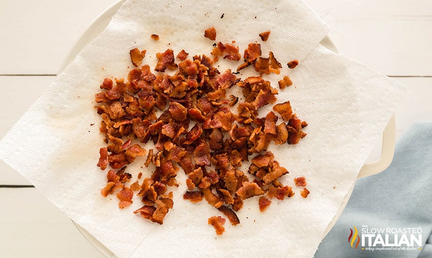 crumbled bacon on a sheet of paper towel