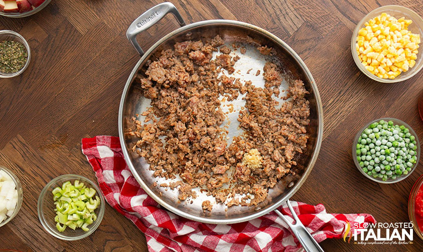 browned sausage in a skillet