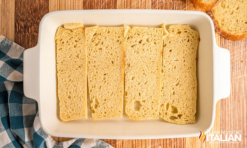 sliced bread added to casserole dish