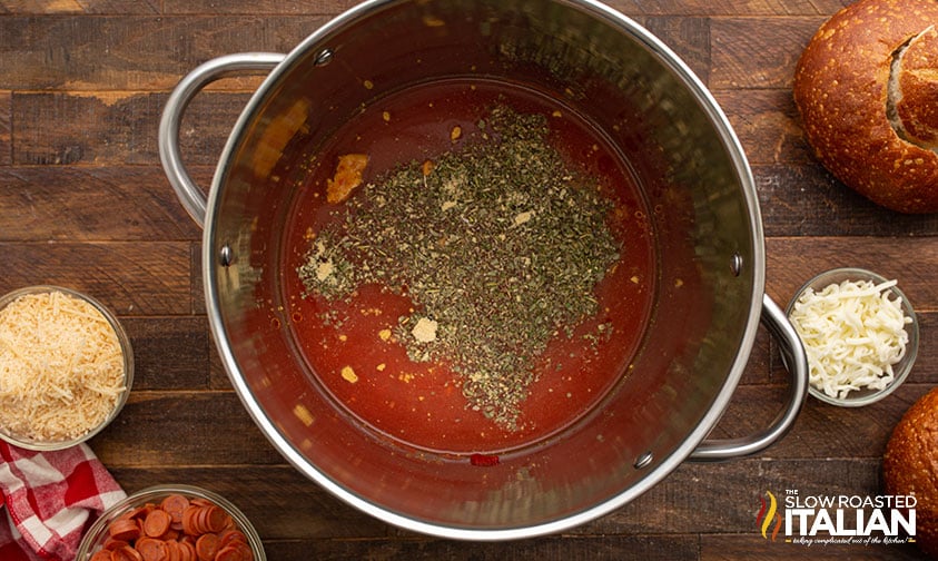 adding seasoning to pepperoni soup recipe