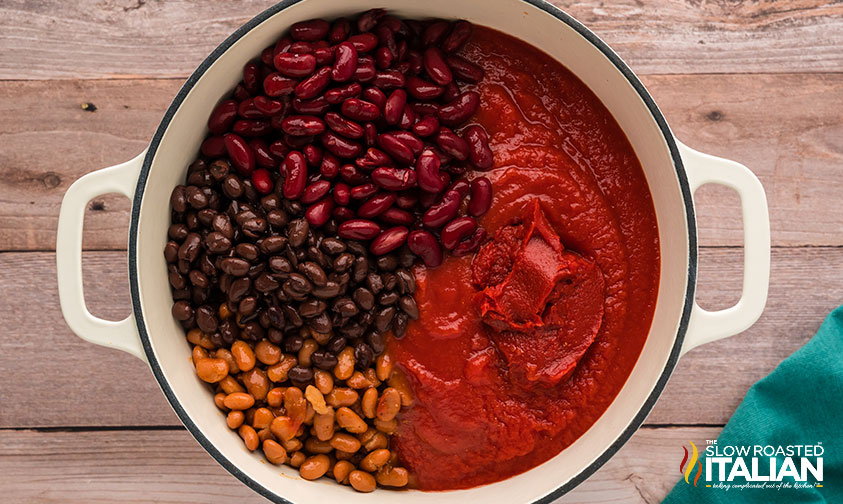 tomato sauce, beans and tomato paste added to large pot