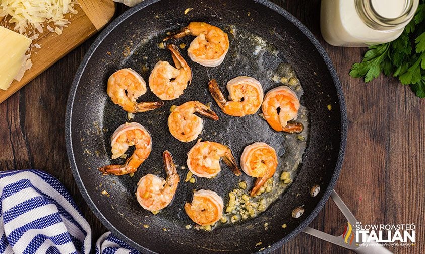 sautéing shrimp in garlic and butter