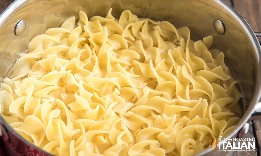 cooked noodles in a pot for chicken noodle casserole