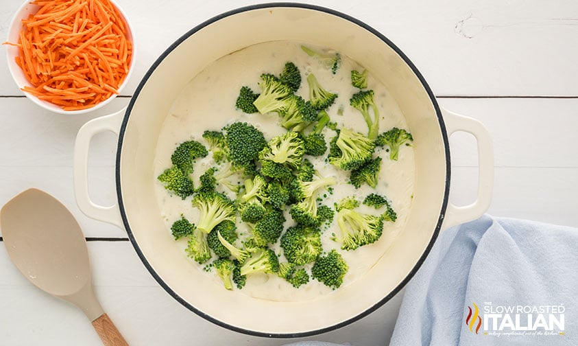 broccoli added to panera broccoli cheddar soup in a large pot