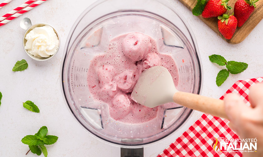 blending strawberries and cream