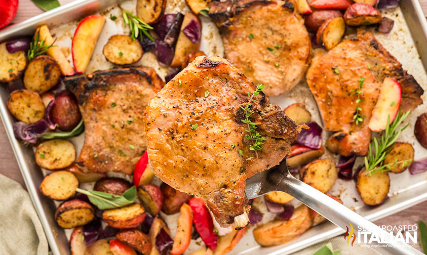 sheet pan pork chops on a spatula