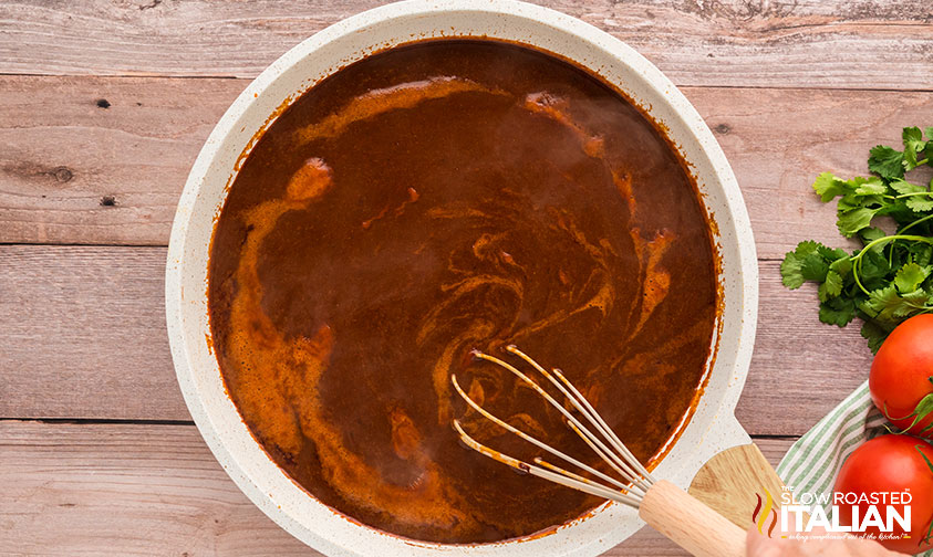 whisking red enchilada sauce