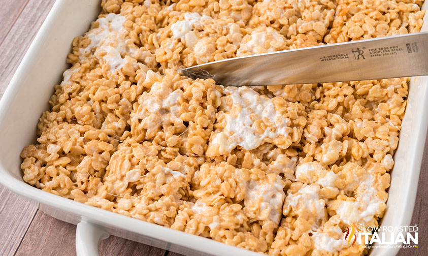 slicing salted caramel rice krispie treats