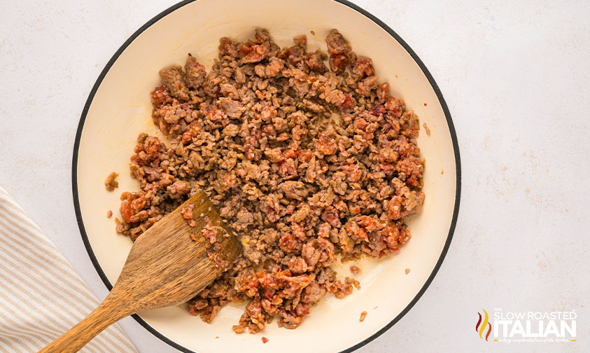 browned italian sausage in a skillet