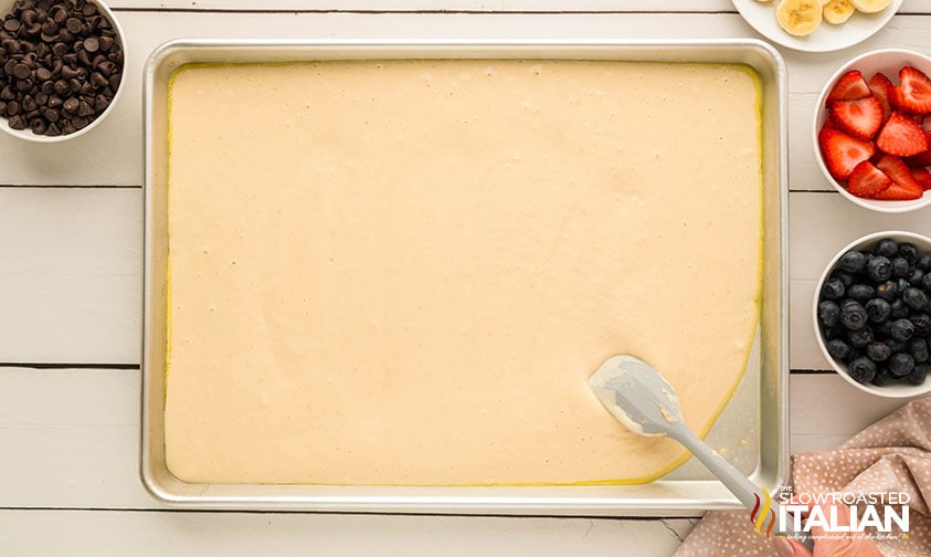 pancake batter poured into baking sheet