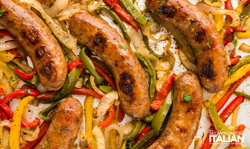 closeup of sheet pan sausage and peppers