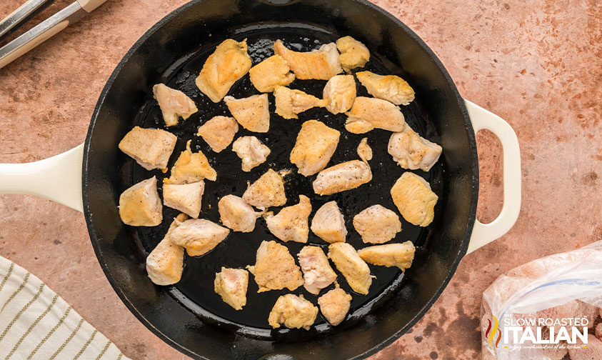 chicken cooking in a skillet