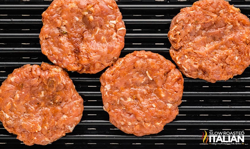 chicken burger patties on a grill