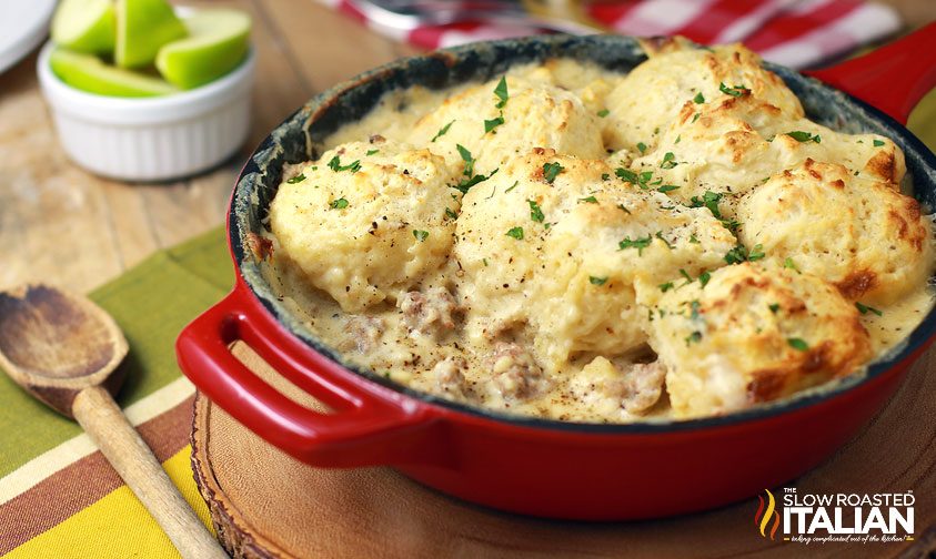 drop biscuits with sausage gravy in red skillet