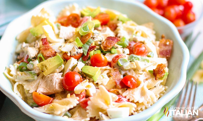 bowl of cobb salad with pasta tossed in ranch dressing