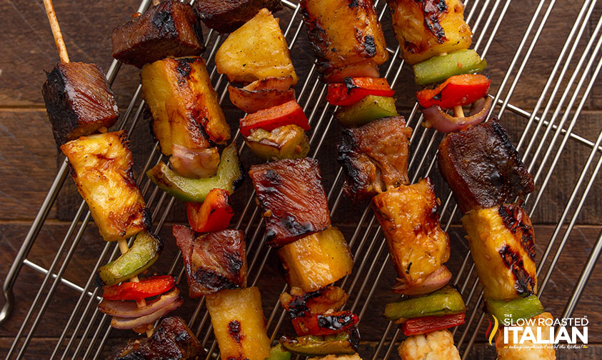 grilled Hawaiian kabobs on a wire rack