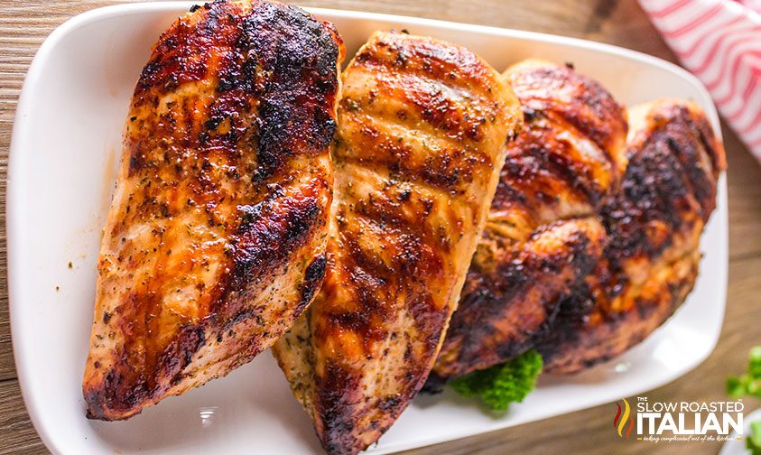 grilled marinated chicken on long tray